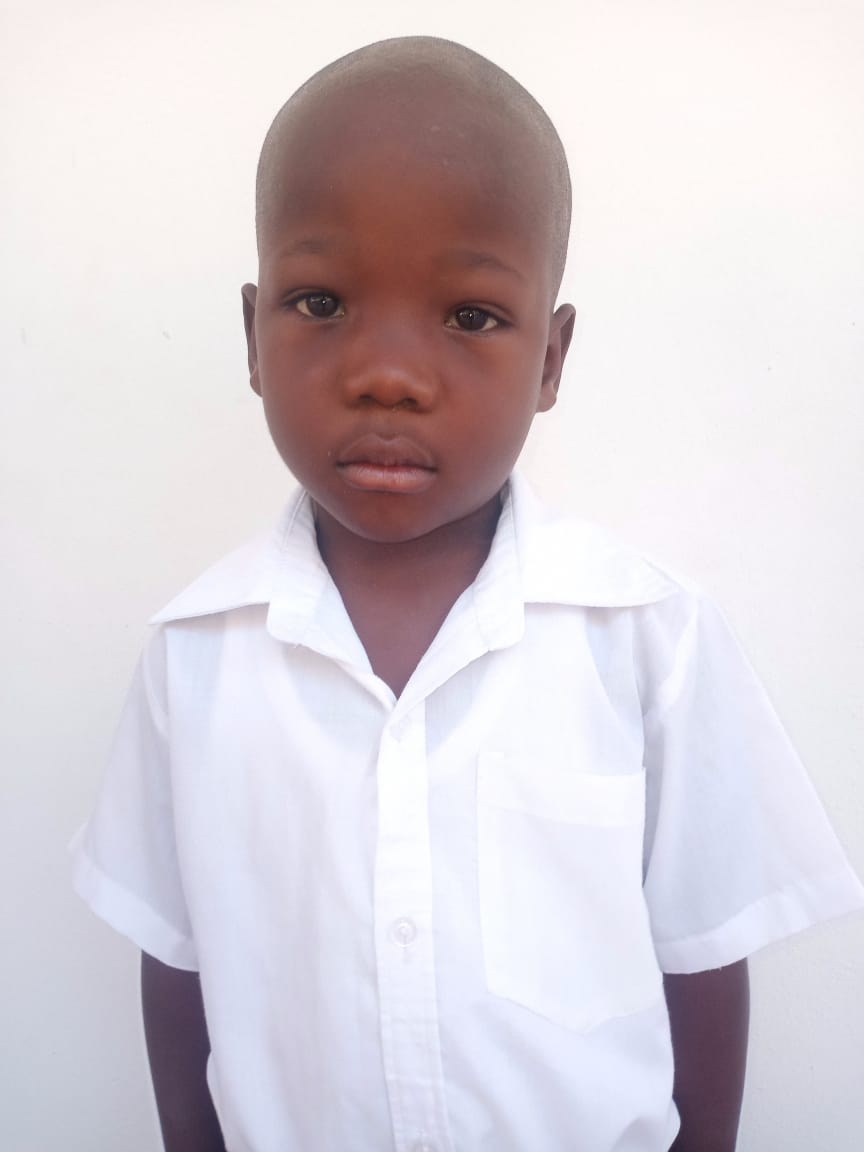 Diovenson Is four years old. He has an older brother and a younger sister. He likes to kick balls.